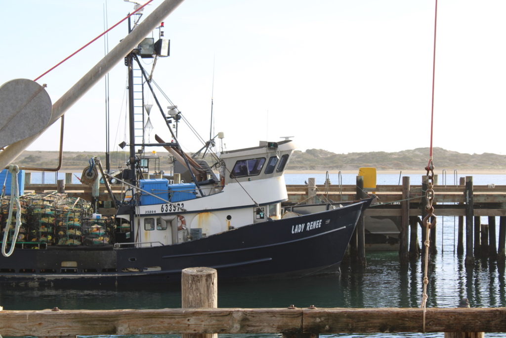 Commercial fishing boat with crab traps on deck